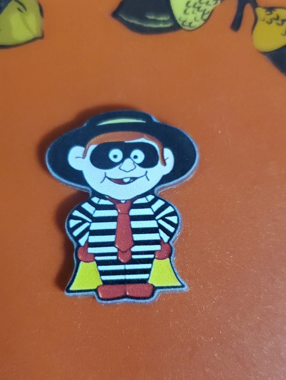 Striped Hamburger Burglar Cartoon Pin - Black, White & Red with Yellow Accent